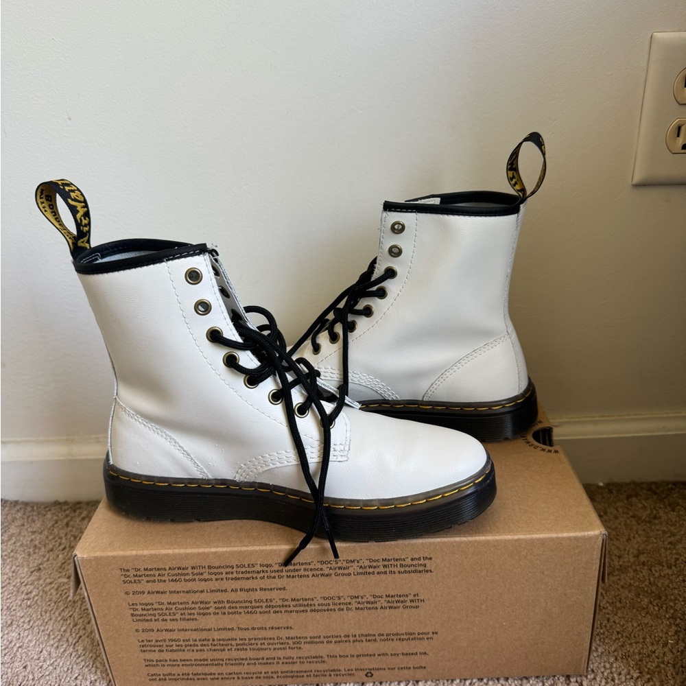 Size 7 White Dr. Martens boots with black sole.